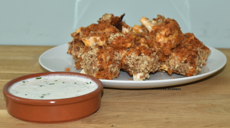 Spicy barbecue buffalo cauliflower served with a tangy ranch dipping sauce