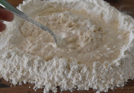 Making the dough in a flour well - make sure there aren't any gaps!