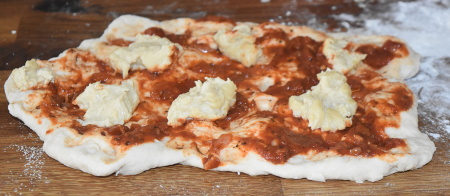 Putting together a vegan pizza Margherita
