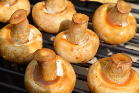 Some tasty barbecue grilled mushrooms cooking over indirect heat