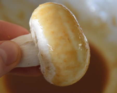 Dipping the mushrooms in their miso marinade