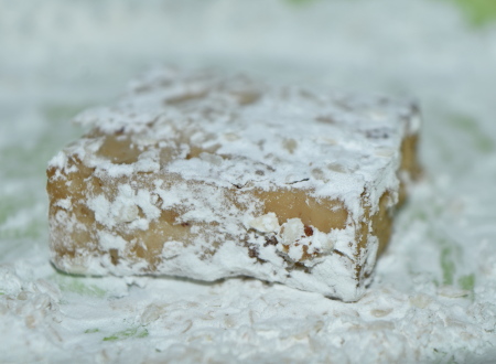 Coating the tofu in cornflour and sesame