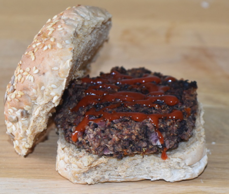 Delicious vegan black bean and quinoa burger with a little drizzle of homemade tomato ketchup!